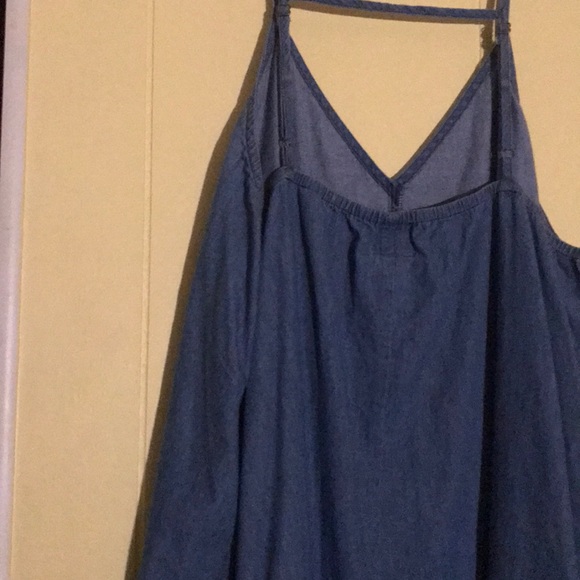 A denim dress with a design on the bottom - Picture 4 of 4